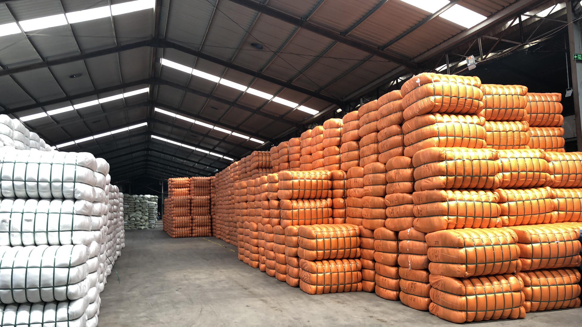 Recycled polyester staple fiber bales in the warehouse at PT. HARVESTINDO INTERNATIONAL, Tangerang, Indonesia
